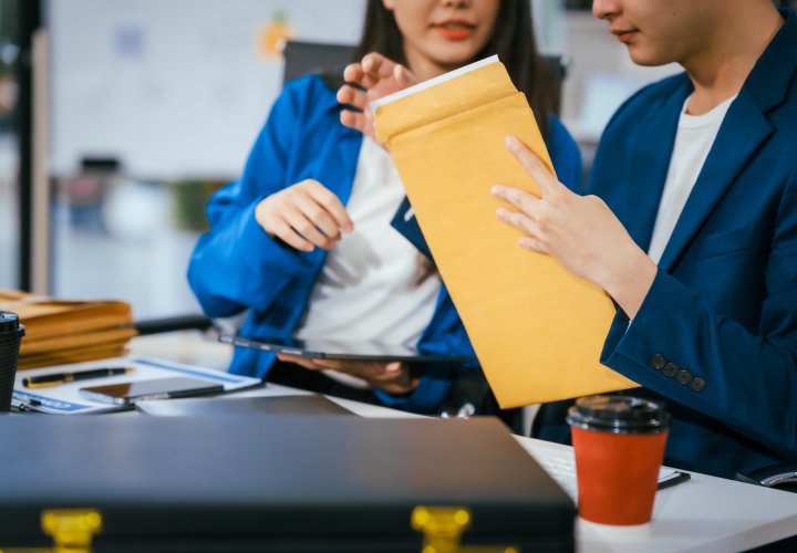 Businesswomen checking documents in office
